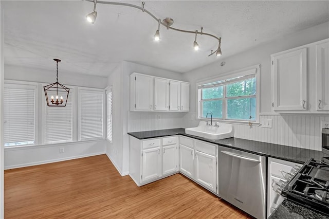 4440 Coventry Ct NE, Roswell, GA 30075 - kitchen with dishwasher, a sink, range, and dark countertops