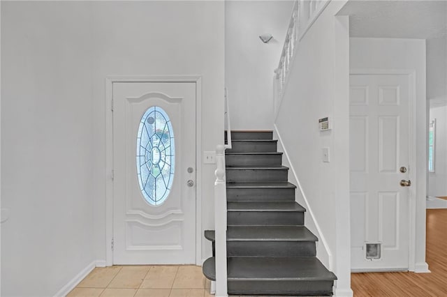 4440 Coventry Ct NE, Roswell, GA 30075 - foyer entrance featuring stairs, baseboards, and light tile patterned floors