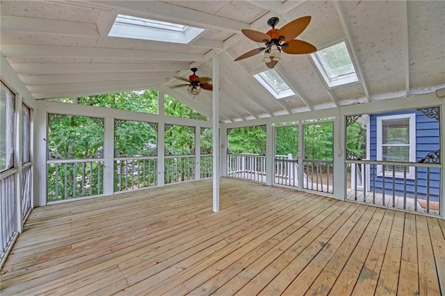 4440 Coventry Ct NE, Roswell, GA 30075 - unfurnished sunroom featuring a skylight, a ceiling fan, vaulted ceiling, hardwood / wood-style flooring, and a wooden deck