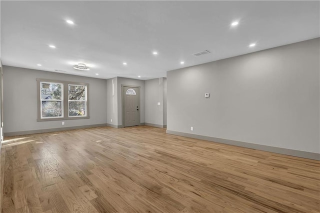 unfurnished room featuring light wood-type flooring