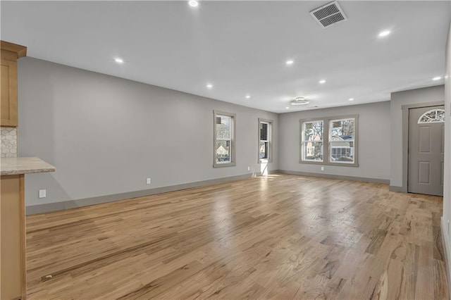 unfurnished living room with light hardwood / wood-style flooring