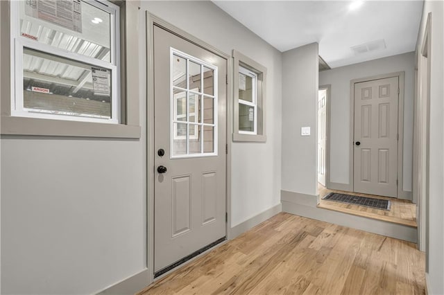 doorway to outside with light hardwood / wood-style floors