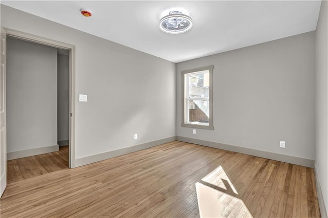 unfurnished room featuring light hardwood / wood-style floors