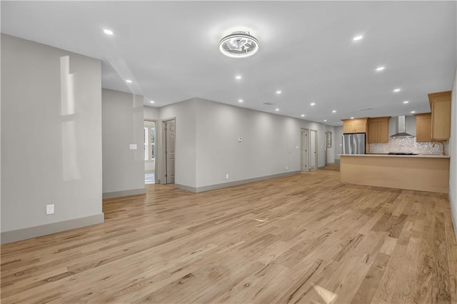 unfurnished living room with light wood-type flooring