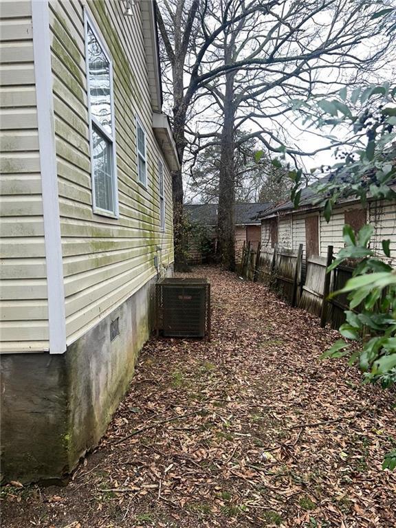 view of yard featuring central AC unit