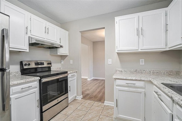 kitchen featuring stainless steel appliances, white cabinets, a textured ceiling, and light stone counters