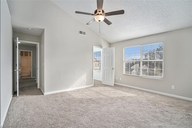 unfurnished bedroom with high vaulted ceiling, a textured ceiling, ceiling fan, and light carpet