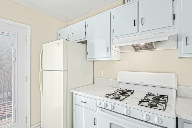 kitchen featuring white cabinetry and white appliances