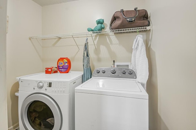 laundry room with washer and dryer