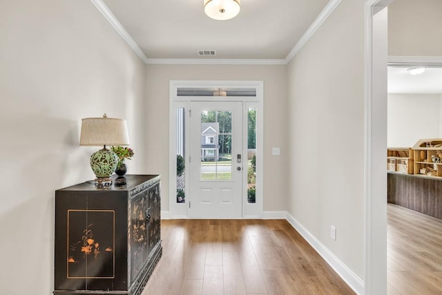 259 Dunagan Ct, Winder, GA 30680 - foyer entrance featuring wood finished floors and ornamental molding