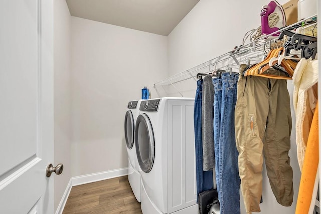259 Dunagan Ct, Winder, GA 30680 - washroom featuring washer and clothes dryer and wood finished floors