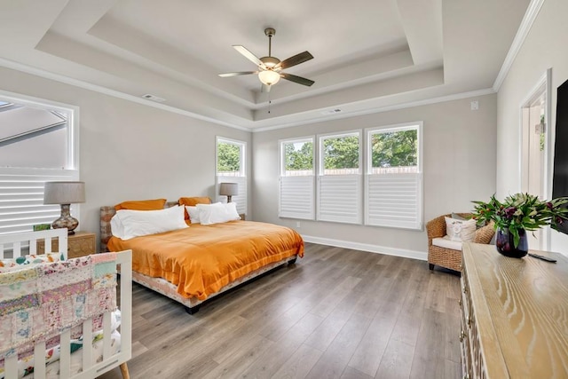 259 Dunagan Ct, Winder, GA 30680 - bedroom featuring a tray ceiling, wood finished floors, and ceiling fan