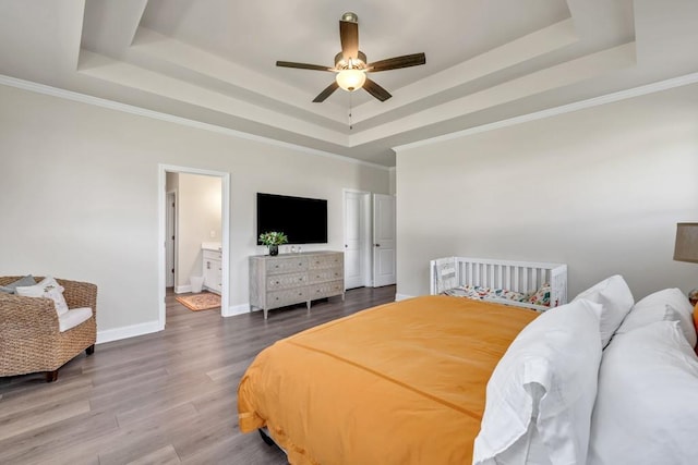 259 Dunagan Ct, Winder, GA 30680 - bedroom with a raised ceiling, wood finished floors, and ornamental molding
