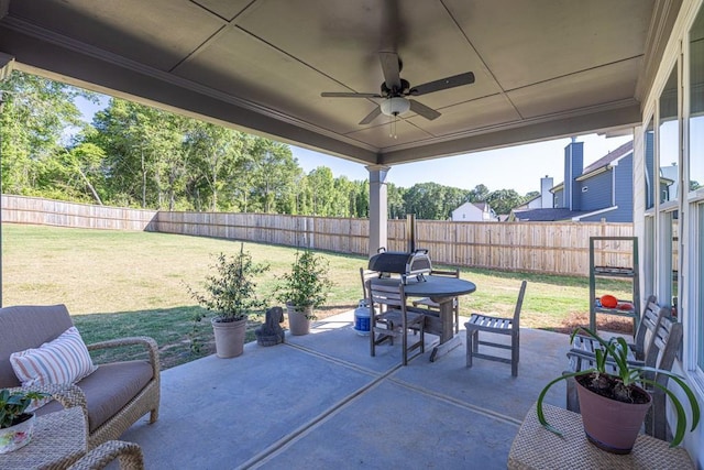 259 Dunagan Ct, Winder, GA 30680 - fenced backyard with ceiling fan and a patio