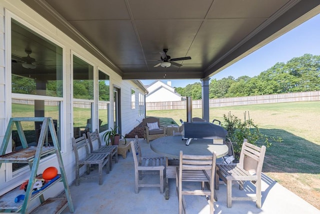 259 Dunagan Ct, Winder, GA 30680 - fenced backyard with a ceiling fan, a patio, and outdoor dining area