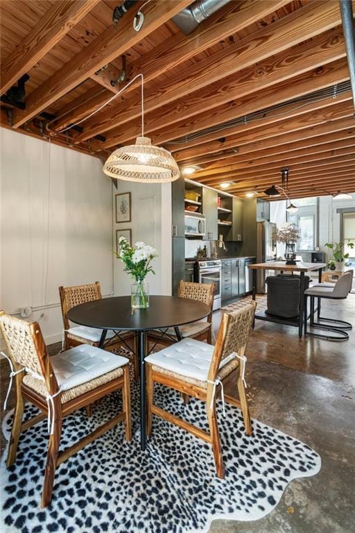 1661 La France St NE Unit 222, Atlanta, GA 30307 - dining area featuring concrete flooring and a wood ceiling with exposed beams
