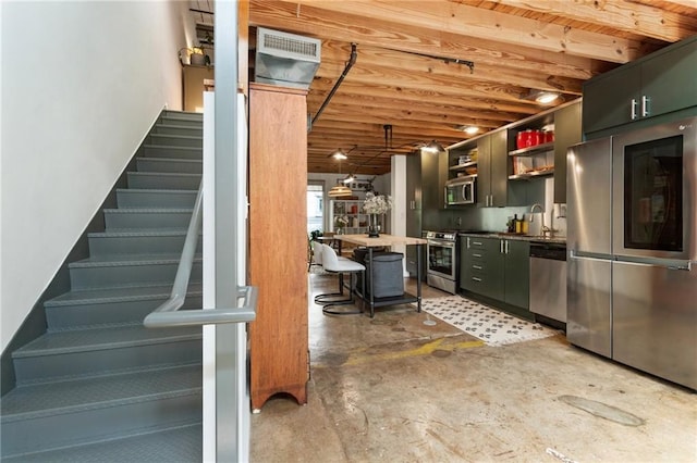 1661 La France St NE Unit 222, Atlanta, GA 30307 - kitchen featuring stainless steel appliances, open shelves, concrete floors, a breakfast bar area, and dark countertops