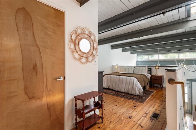 1661 La France St NE Unit 222, Atlanta, GA 30307 - bedroom with hardwood / wood-style flooring and a wood ceiling with exposed beams