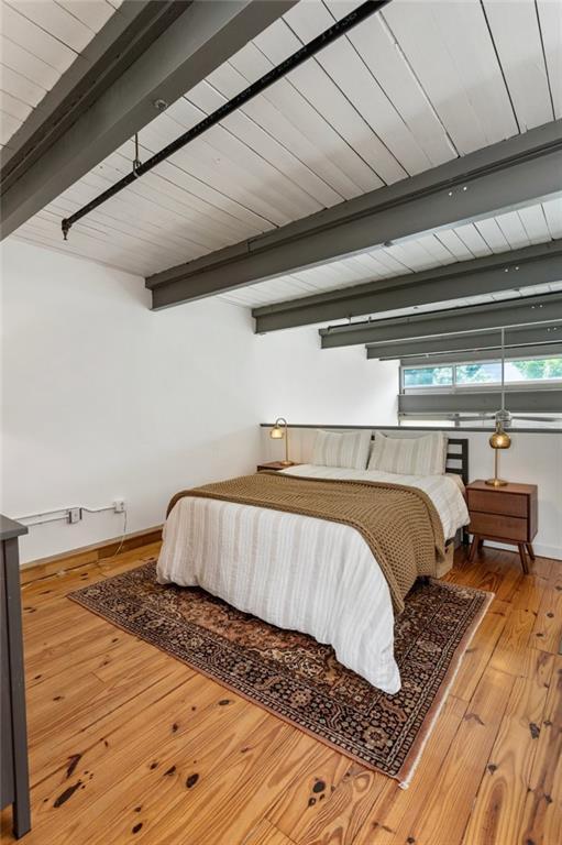 1661 La France St NE Unit 222, Atlanta, GA 30307 - bedroom featuring beamed ceiling and hardwood / wood-style flooring