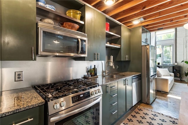 1661 La France St NE Unit 222, Atlanta, GA 30307 - kitchen with appliances with stainless steel finishes, open shelves, finished concrete flooring, and stone countertops