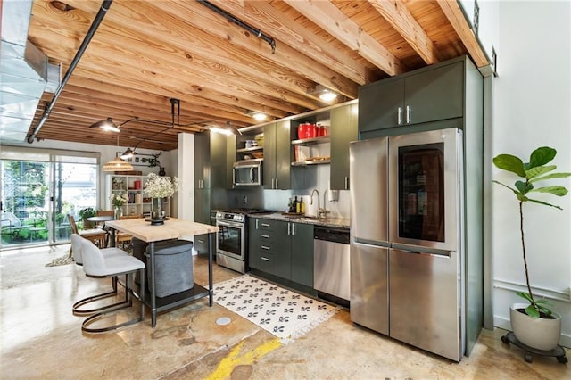 1661 La France St NE Unit 222, Atlanta, GA 30307 - kitchen featuring appliances with stainless steel finishes, open shelves, concrete flooring, and wooden ceiling