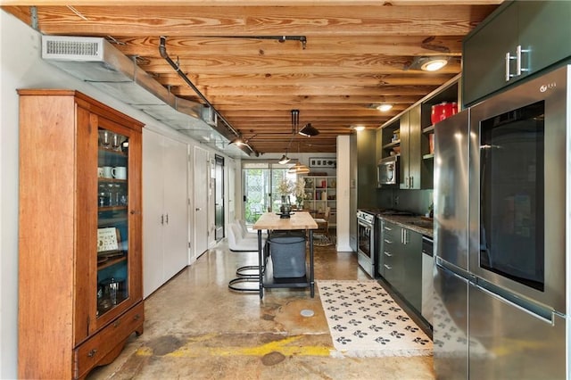 1661 La France St NE Unit 222, Atlanta, GA 30307 - kitchen with appliances with stainless steel finishes, open shelves, pendant lighting, and concrete flooring