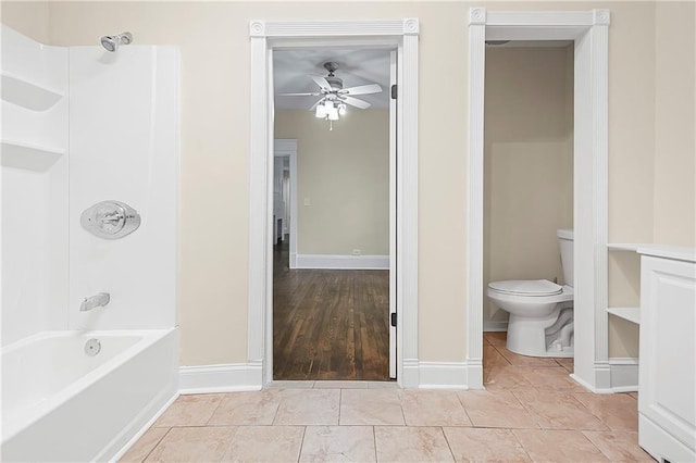 bathroom featuring tile patterned floors, ceiling fan, tub / shower combination, and toilet