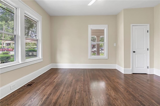 empty room featuring dark hardwood / wood-style flooring