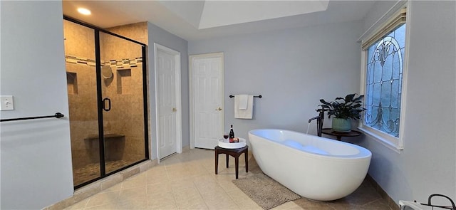 409 Misty Ridge Way, Woodstock, GA 30189 - bathroom featuring a freestanding tub, a stall shower, and tile patterned floors