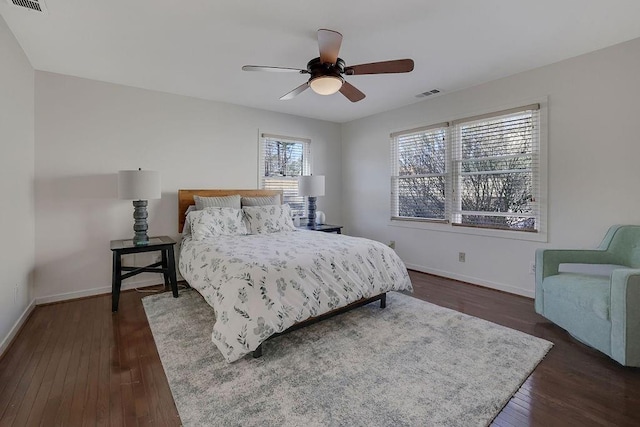 bedroom featuring dark wood-type flooring and ceiling fan