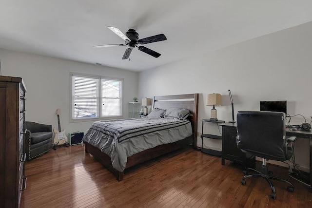 bedroom featuring ceiling fan and dark hardwood / wood-style floors