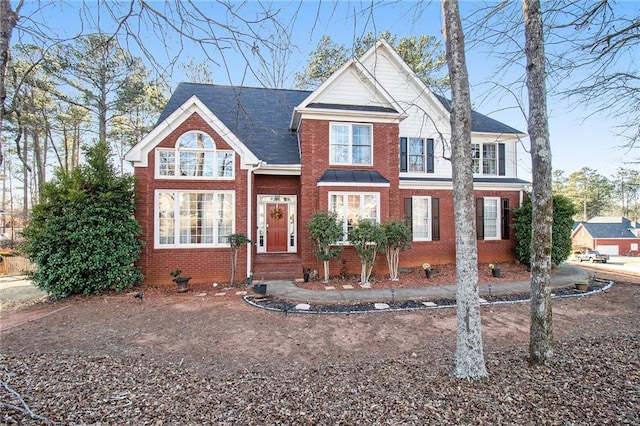 view of front of house featuring brick siding