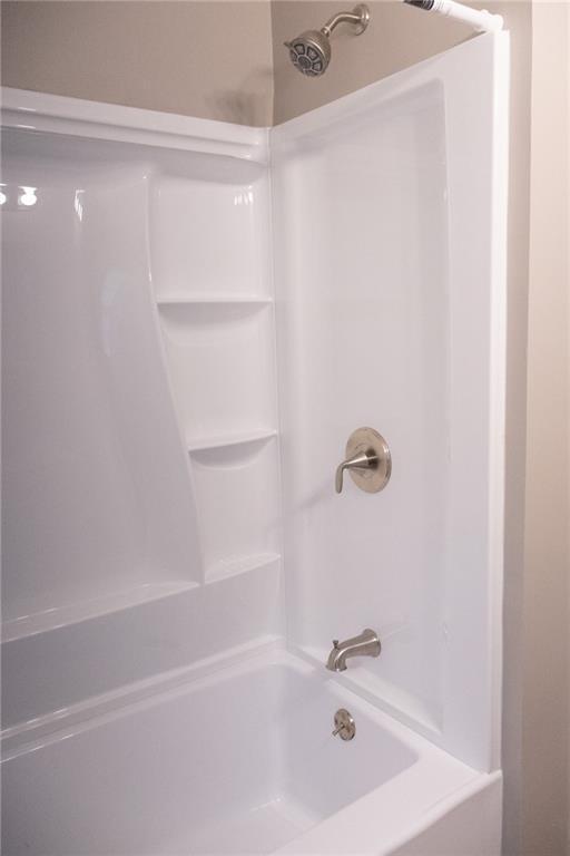 bathroom with shower / bathtub combination