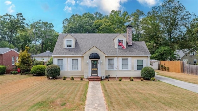 cape cod house featuring a front lawn