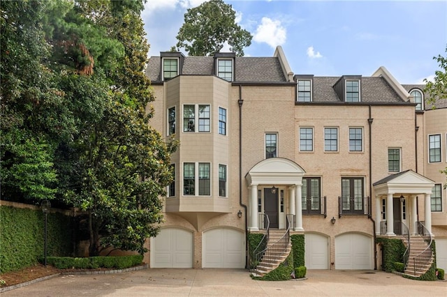 92 Old Ivy Rd NE Unit 6, Atlanta, GA 30342 - multi unit property with a garage, concrete driveway, and stairway