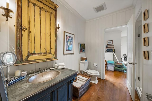 92 Old Ivy Rd NE Unit 6, Atlanta, GA 30342 - bathroom with hardwood / wood-style flooring, vanity, and crown molding