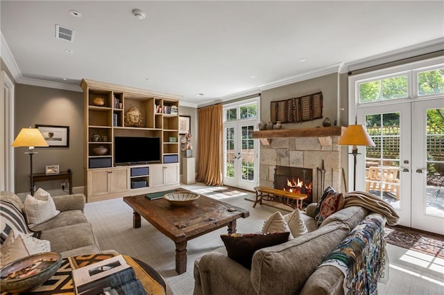 92 Old Ivy Rd NE Unit 6, Atlanta, GA 30342 - living area featuring french doors, crown molding, a stone fireplace, and recessed lighting
