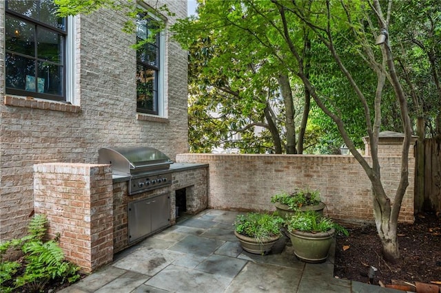 92 Old Ivy Rd NE Unit 6, Atlanta, GA 30342 - view of patio / terrace with exterior kitchen