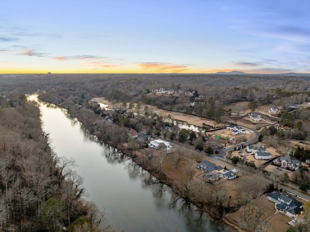 aerial view at dusk with a water view