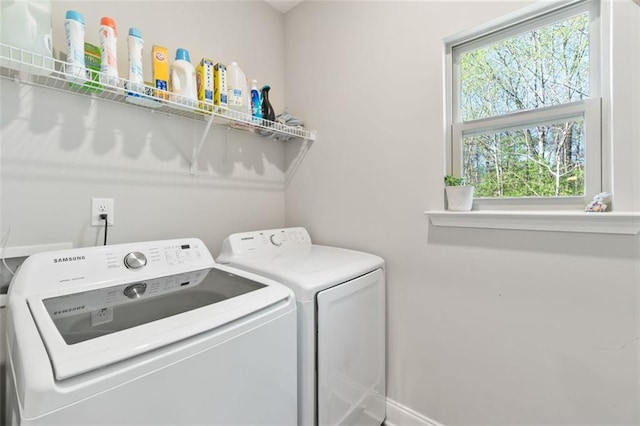laundry room featuring independent washer and dryer and laundry area