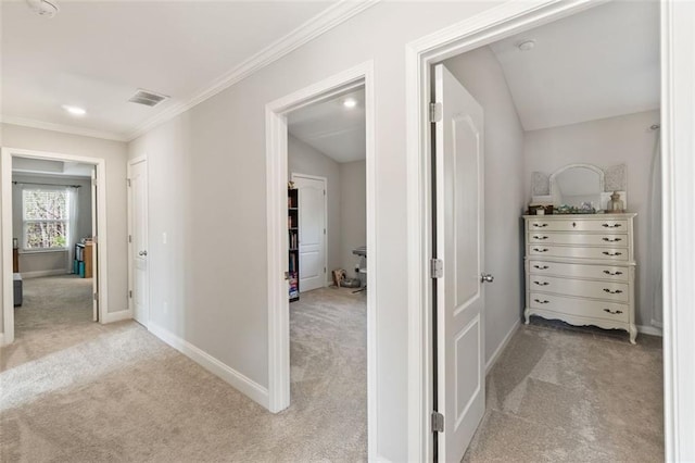 hall featuring crown molding, baseboards, light colored carpet, and recessed lighting