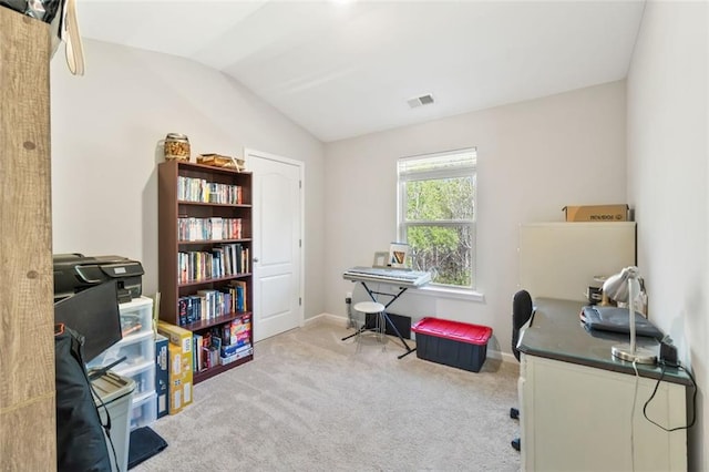 home office featuring baseboards, vaulted ceiling, visible vents, and carpet floors