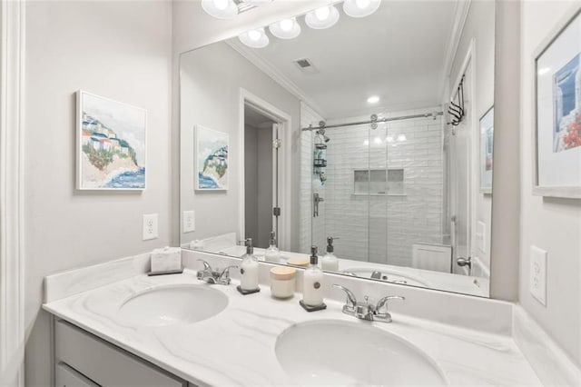 full bathroom featuring crown molding, double vanity, a sink, and a shower stall
