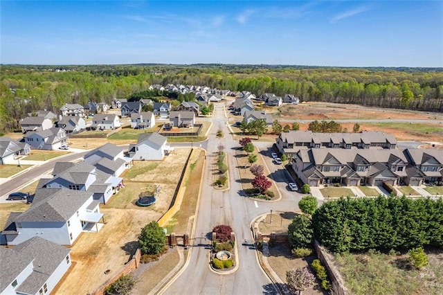 aerial view with a residential view and a view of trees