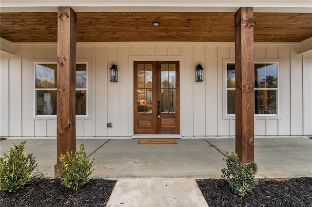 entrance to property with french doors and board and batten siding