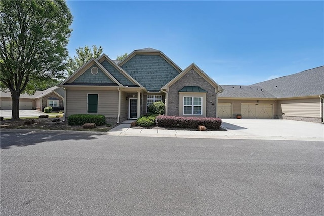 223 Glens Loop, Woodstock, GA 30188 - view of front of home with an attached garage and concrete driveway