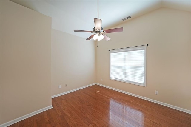223 Glens Loop, Woodstock, GA 30188 - unfurnished room with wood finished floors, ceiling fan, baseboards, and lofted ceiling