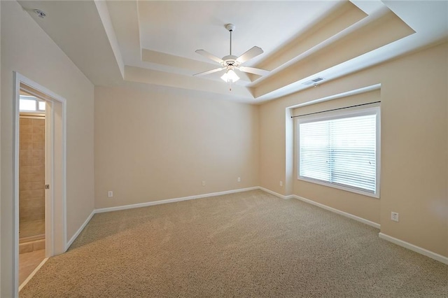223 Glens Loop, Woodstock, GA 30188 - spare room with a raised ceiling, ceiling fan, healthy amount of natural light, and carpet floors