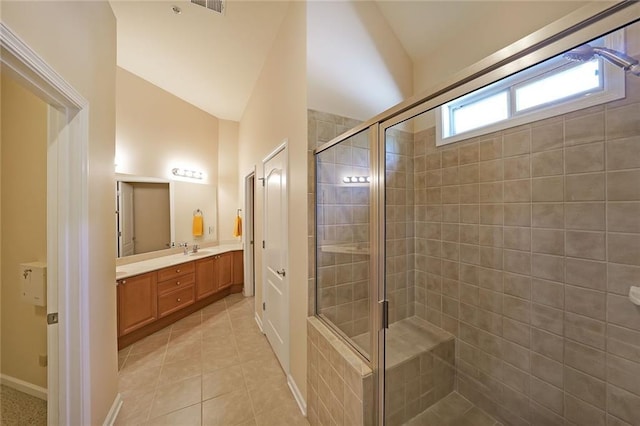 223 Glens Loop, Woodstock, GA 30188 - bathroom featuring a shower stall, tile patterned flooring, vanity, lofted ceiling, and baseboards