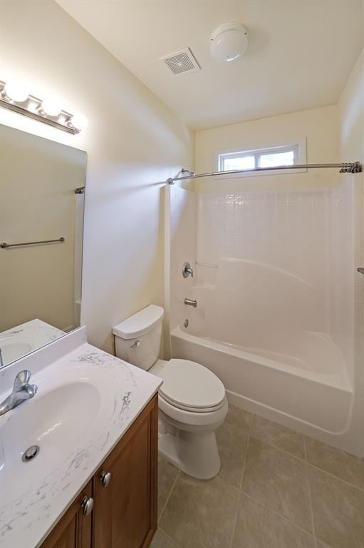 223 Glens Loop, Woodstock, GA 30188 - bathroom featuring toilet, washtub / shower combination, tile patterned floors, and vanity